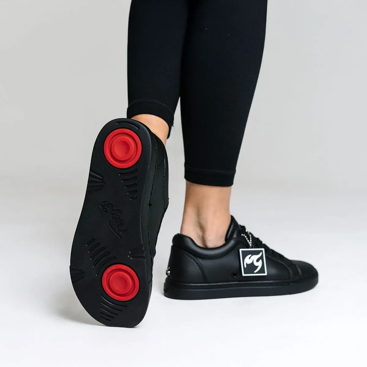 All-black | Low-top (Collective) Enhanced cushioning offers reliable shock absorption